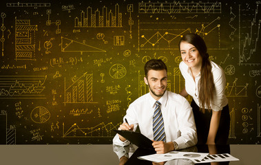Business couple with diagram background