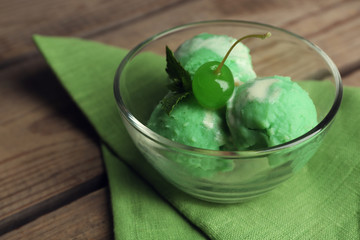 Homemade mint ice-cream on wooden background