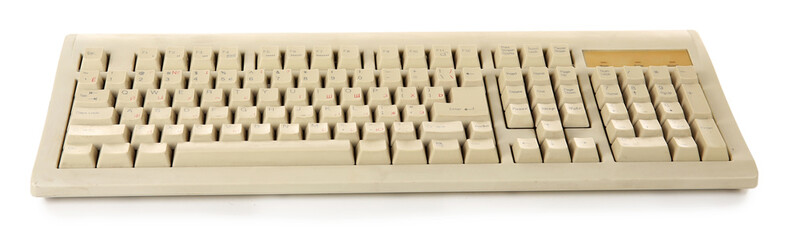 Old keyboard isolated on white
