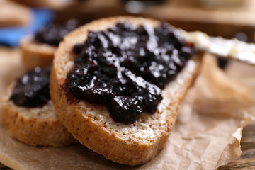 Fresh toast with butter and jam on table close up