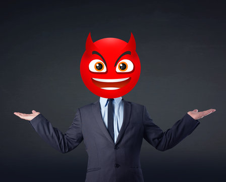 businessman wears devil smiley face