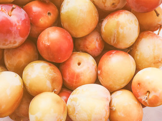 Retro looking Prune fruits background