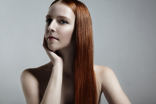 redhead woman with a white porcelain skin