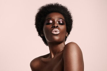 black woman with a light pink lips sending kiss - 90686659