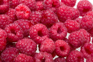 A beautiful selection of freshly picked ripe red raspberries.