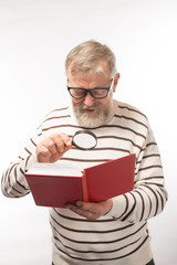 old man with a book with glasses