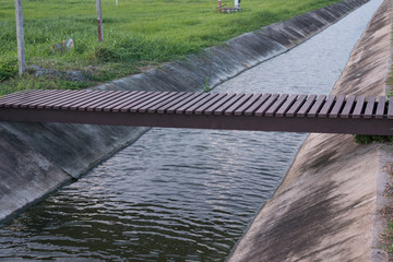 The small bridge overt straigth way of watercourse