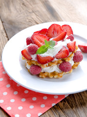 Belgian waffles with strawberries,raspberries and cream
