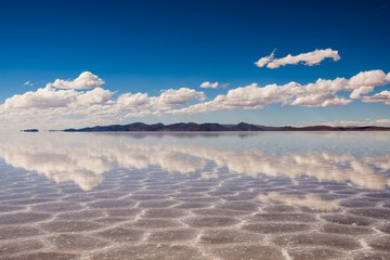 Fototapeta na wymiar clouds reflecting in the uyuni salt lake in bolivia