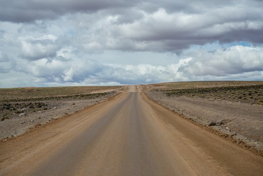 road in the middle of the bolivian altiplano