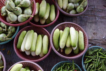 Thailand market vegetable basket selling cucumbers, chilli and C