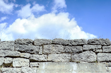 Sky and Stone wall background. Many stones