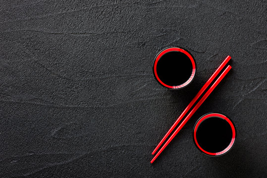 Chopsticks and bowl with soy sauce, discount concept