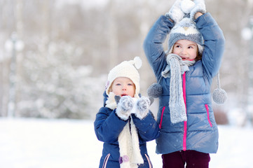 Two funny adorable little sisters winter park