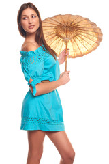 Pretty girl in blue dress with umbrella isolate on white background
