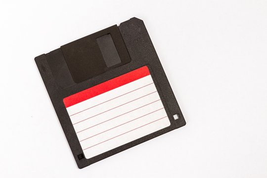 Old floppy diskette isolated on white background