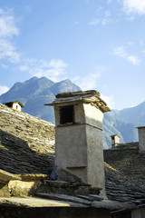 Old mountain house's chimney. Color image