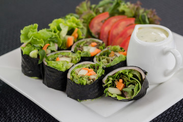 close up shot of salad roll on the white dish