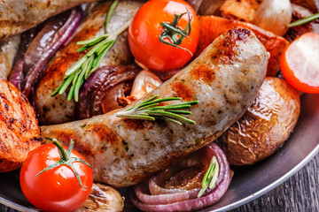 Grilled sausages and vegetables  in  rustic style.