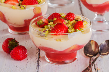 Strawberry tiramisu decorated with pieces of strawberries and pi