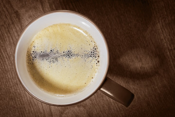 Cup of hot Coffee.
Top view on dark wooden table background.