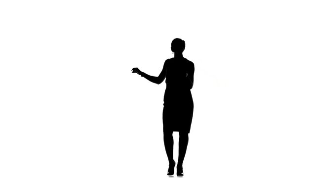 Dancing young woman social latina on a white, silhouette