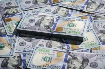 One hundred dollars bills paper money background