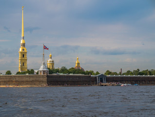 view of the Peter and Paul Fortress, the oldest building in St. Petersburg, Russia  with the tall gold Bell Tower serving as a city landmark