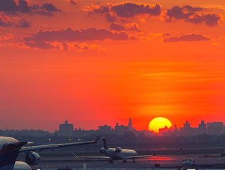 Sunset at the airport with airplanes ready to take off
