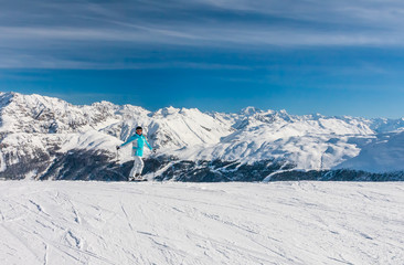 Fototapeta na wymiar Skier mountains in the background. Ski resort Livigno. Italy