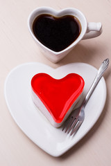 Heart shaped coffee cup and cake