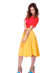 Beautiful woman with curly hair wearing a red jacket, isolated