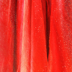 Background from red delicate fabric with sequin