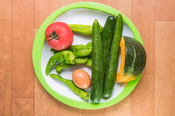 Japan vegetables on plate on woodden floor