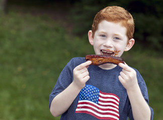 Boy eating rib