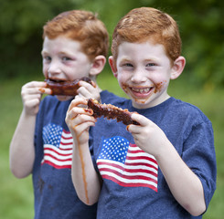 Boys eating rib