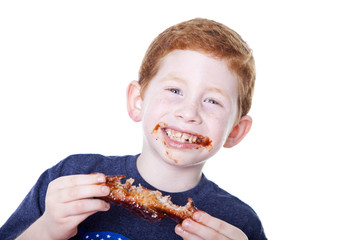 Boy eating rib
