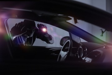 Car Robber with Flashlight - obrazy, fototapety, plakaty