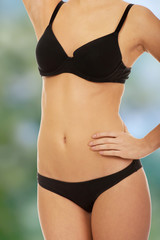 Woman standing in bikini.