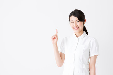 young asian nurse on white background