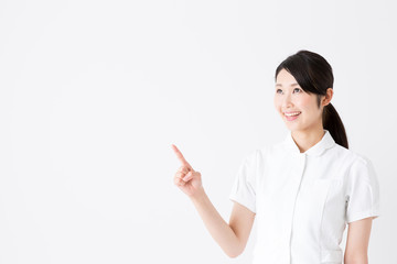 young asian nurse on white background