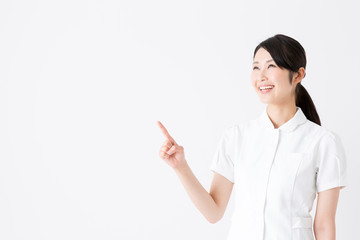 young asian nurse on white background