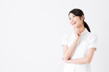 young asian nurse on white background