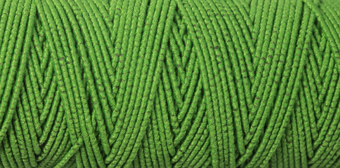 green  thread, textured background