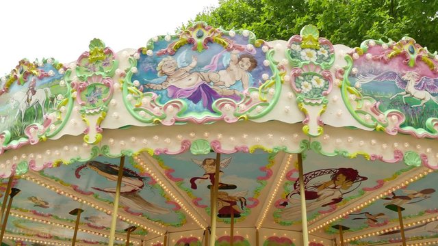 Classical Pretty Fairground Carousel in France.
French style rotating carousel in Carcassonne.
Amusement park for children.
Fairground in France.
