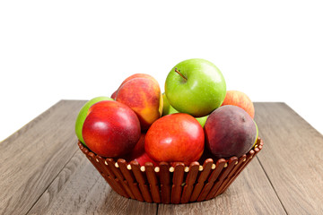 nectarines, apples and peaches in basket