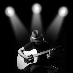 Obraz premium Man playing guitar. Black and white photo