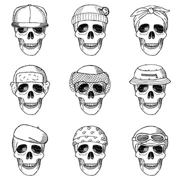 Set of hand drawn skulls with hats