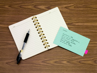 Mandalin; Learning New Language Writing Words on the Notebook