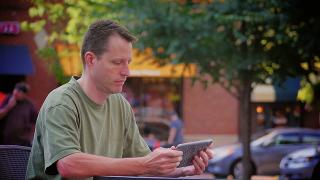 Man Reads eBook Outside 3621